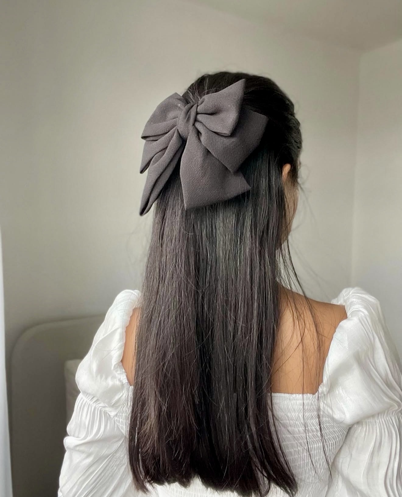 Chic High Ponytail With A Dramatic Bow