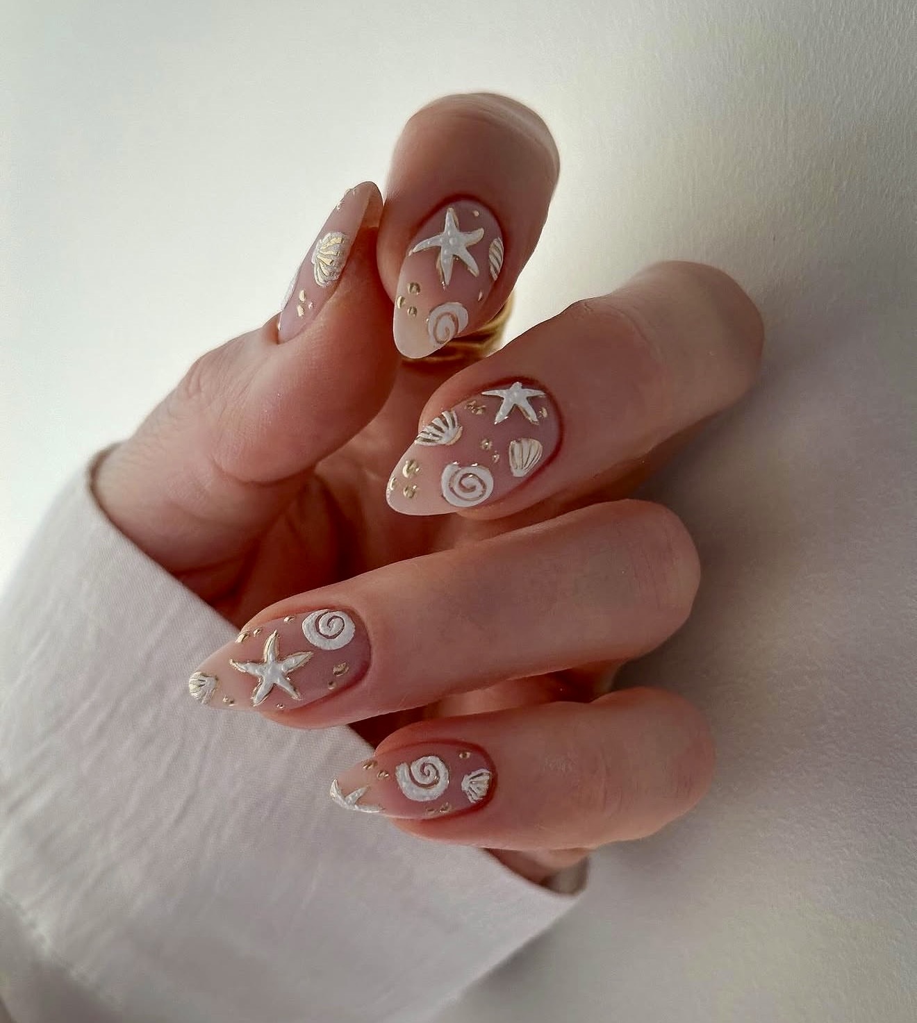 Coastal Seashell Neutral Almond Nails