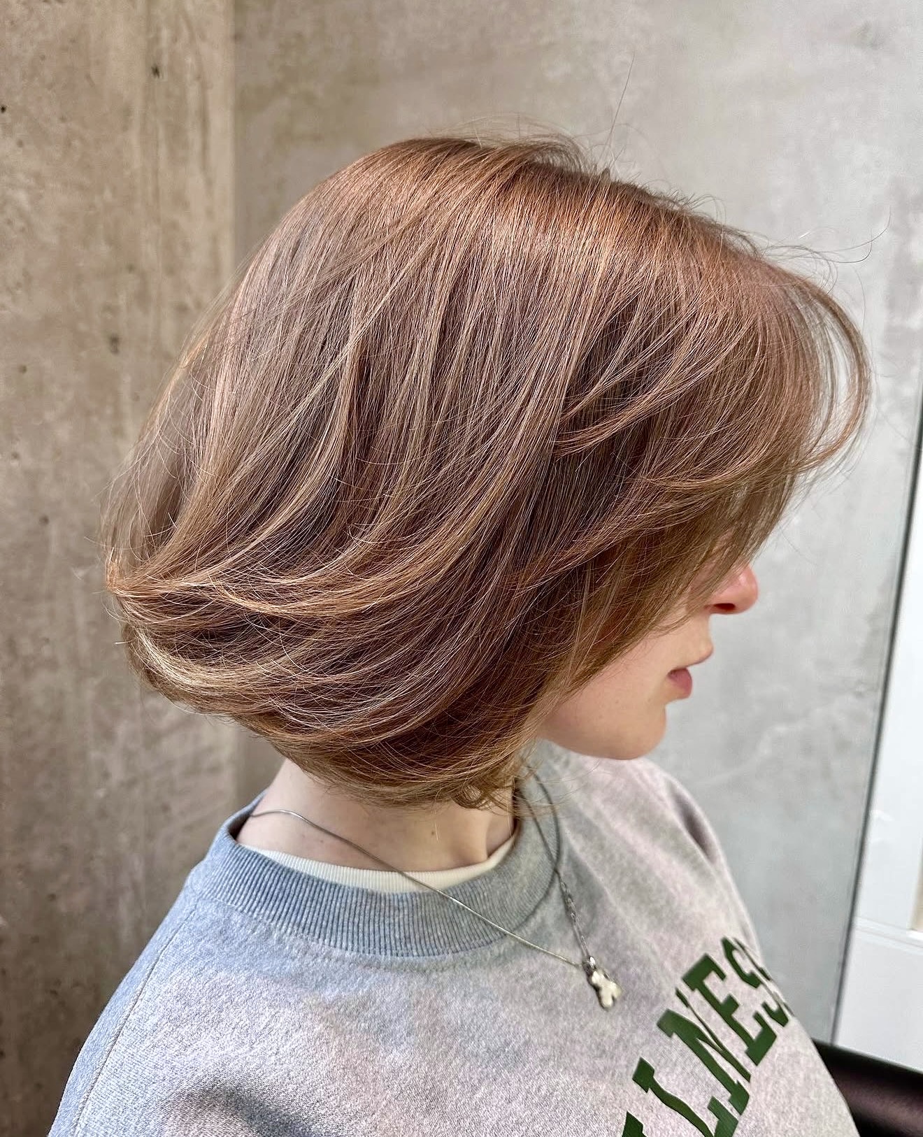 Copper Toned Layered Bob With Subtle Waves