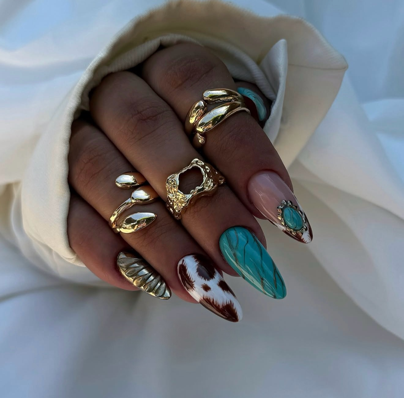 Cow Print & Turquoise Southwestern Almond Nails