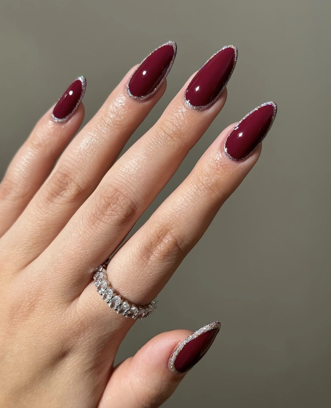 Deep Cherry Red Almond Nails with Silver Glitter Outline