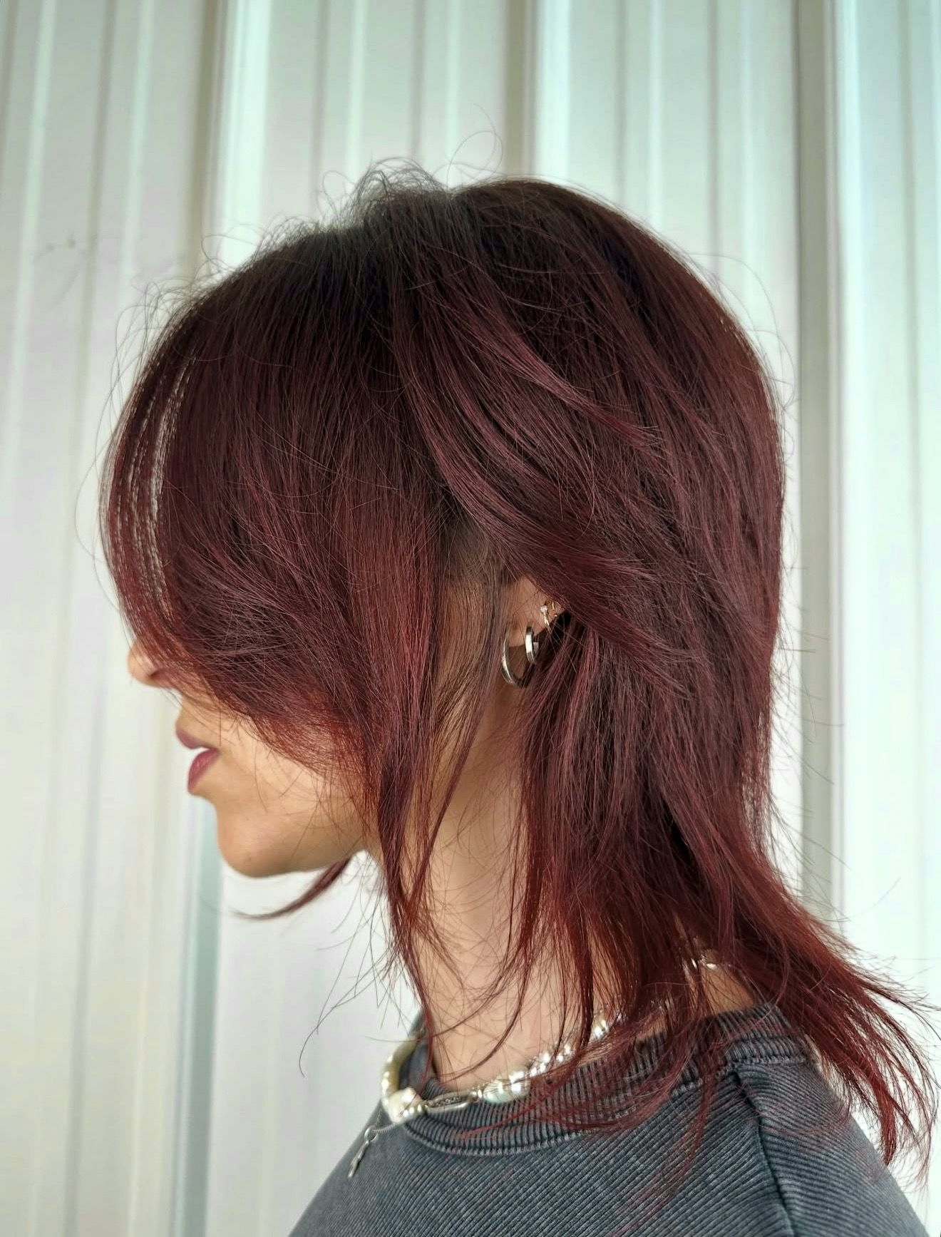 Deep Cherry Red Layered Wolf Cut With Curtain Bangs