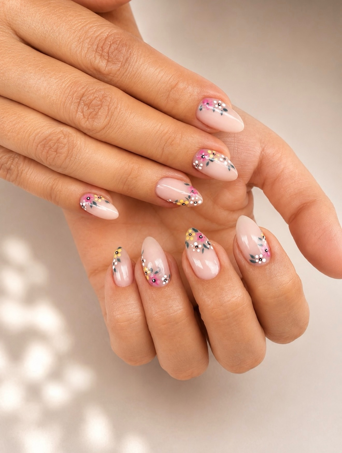 Delicate Floral Almond French Tips with Pink Accents