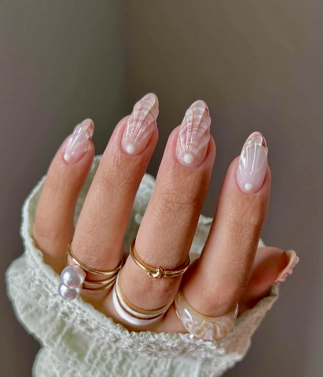 Delicate Seashell Swirl Almond Nails