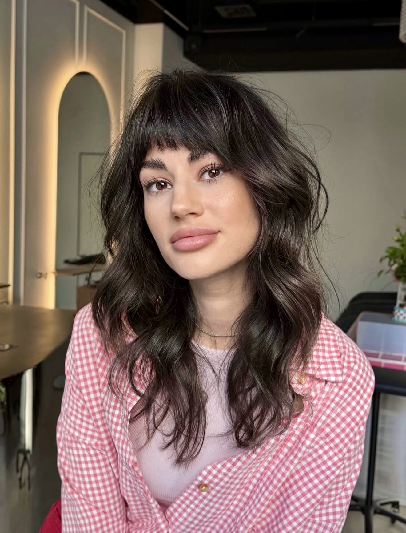 Effortless Dark Brunette Shag With Wispy Bangs