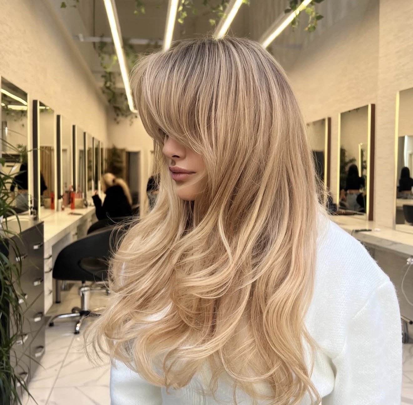 Effortless Honey Blonde Waves With Face Framing Bangs