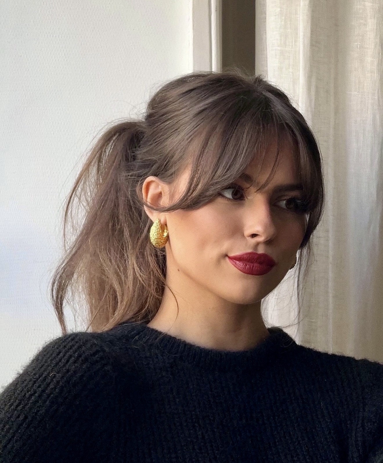 Effortless Ponytail With Face-Framing Curtain Bangs