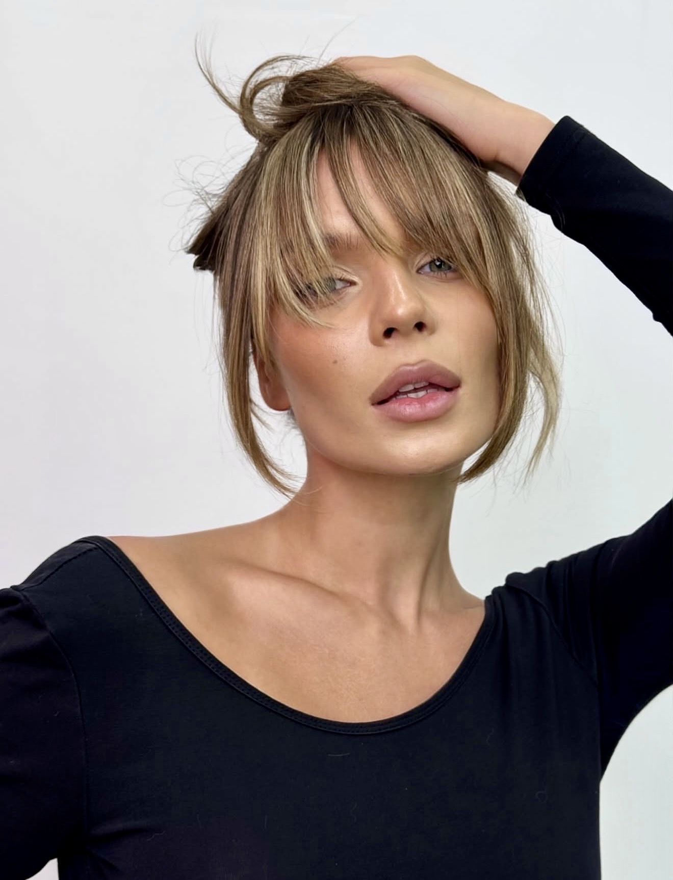 Effortless Tousled Bun With Wispy Curtain Bangs