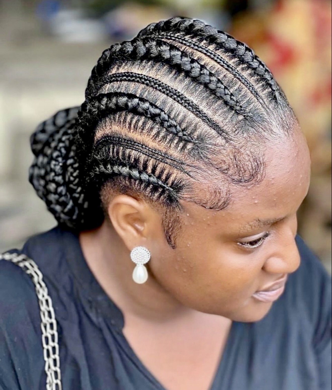 Elegant Cornrow Braids with a Sleek Low Bun