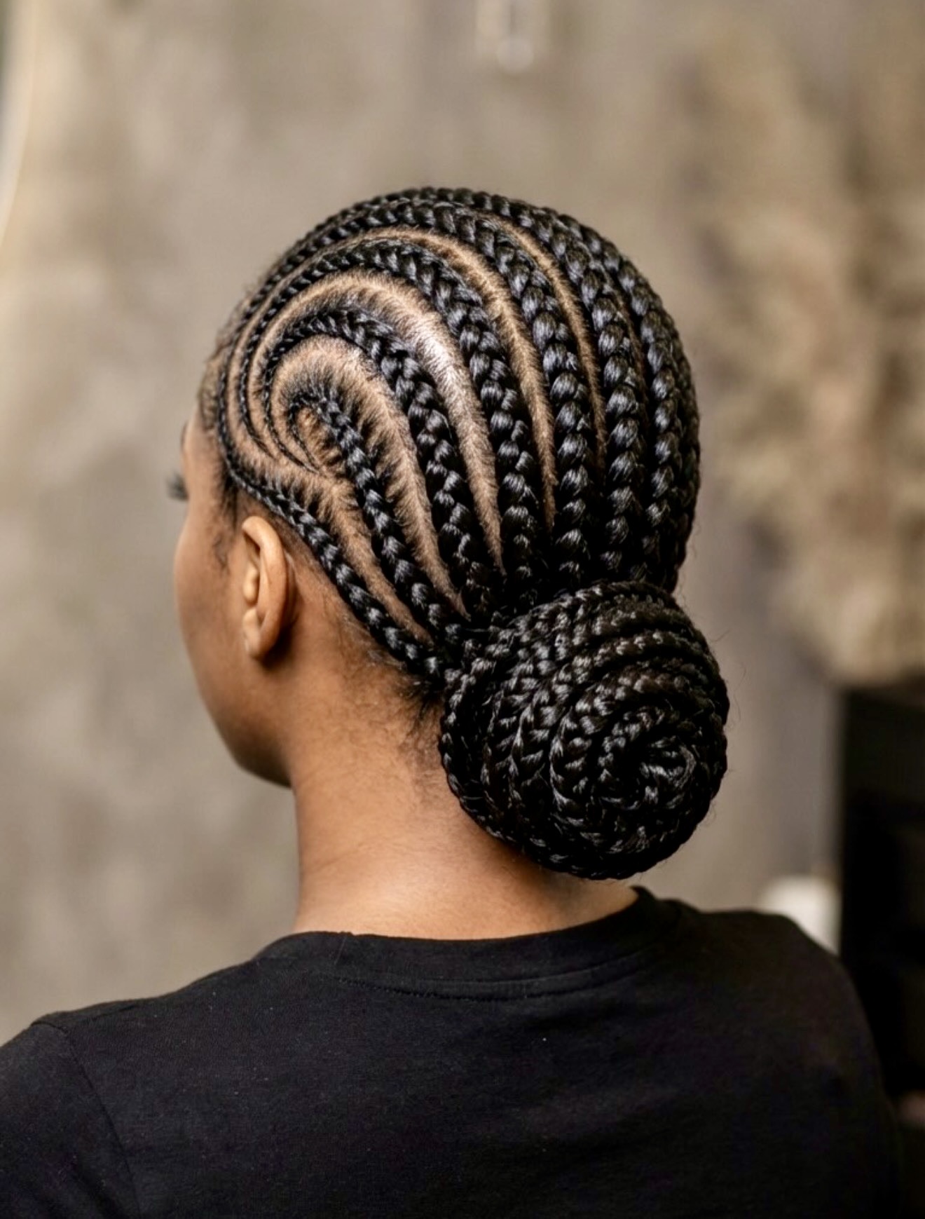 Elegant Cornrow Updo With Swirl Design