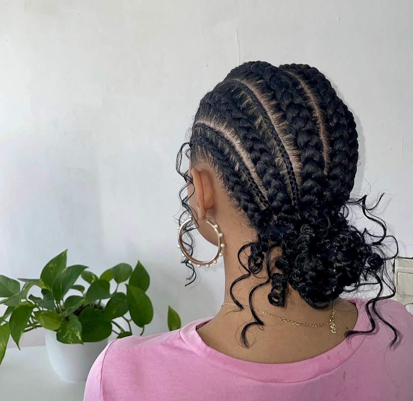 Elegant Cornrows With Curly Tendrils Bun