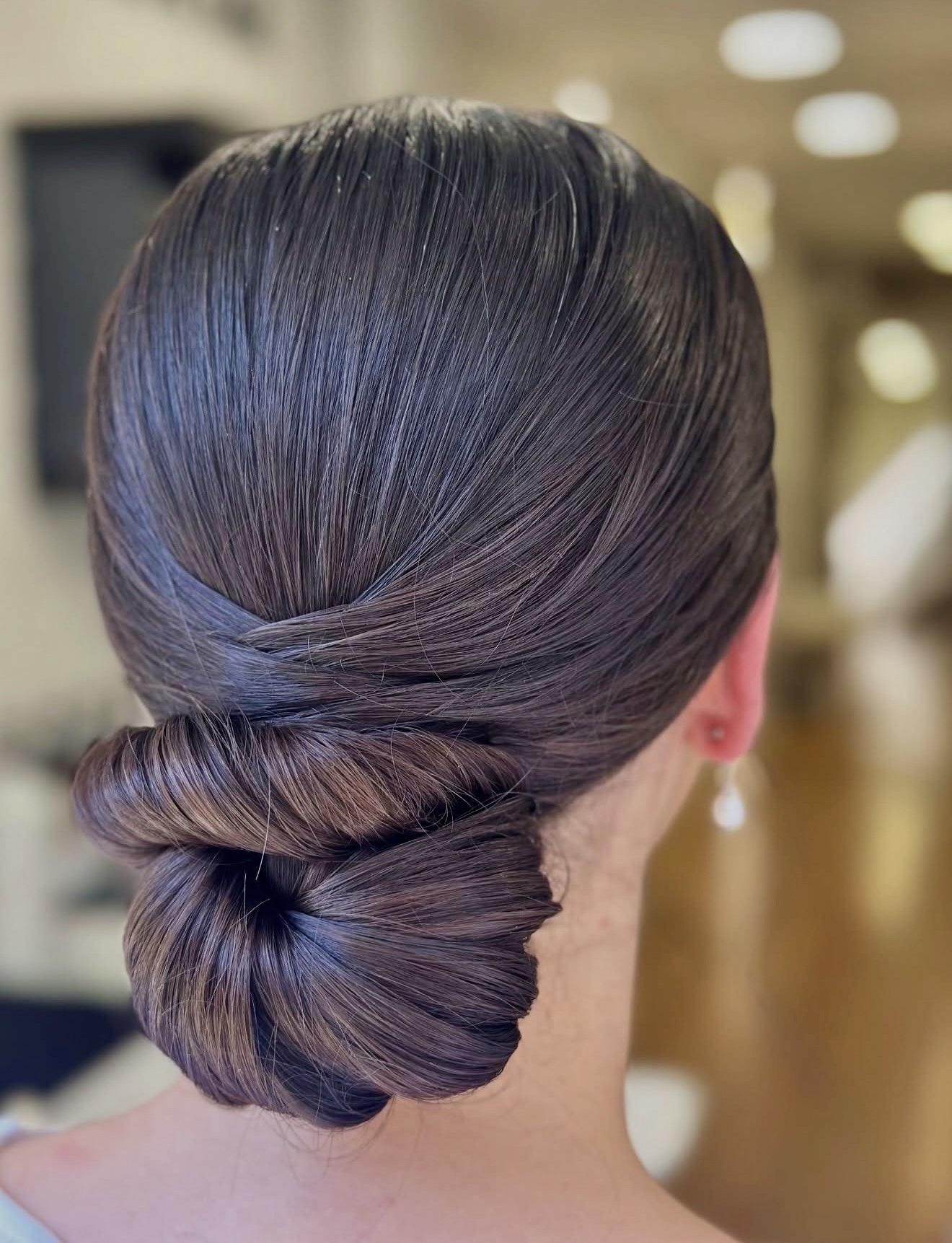 Elegant Twisted Low Bun For Polished Updo
