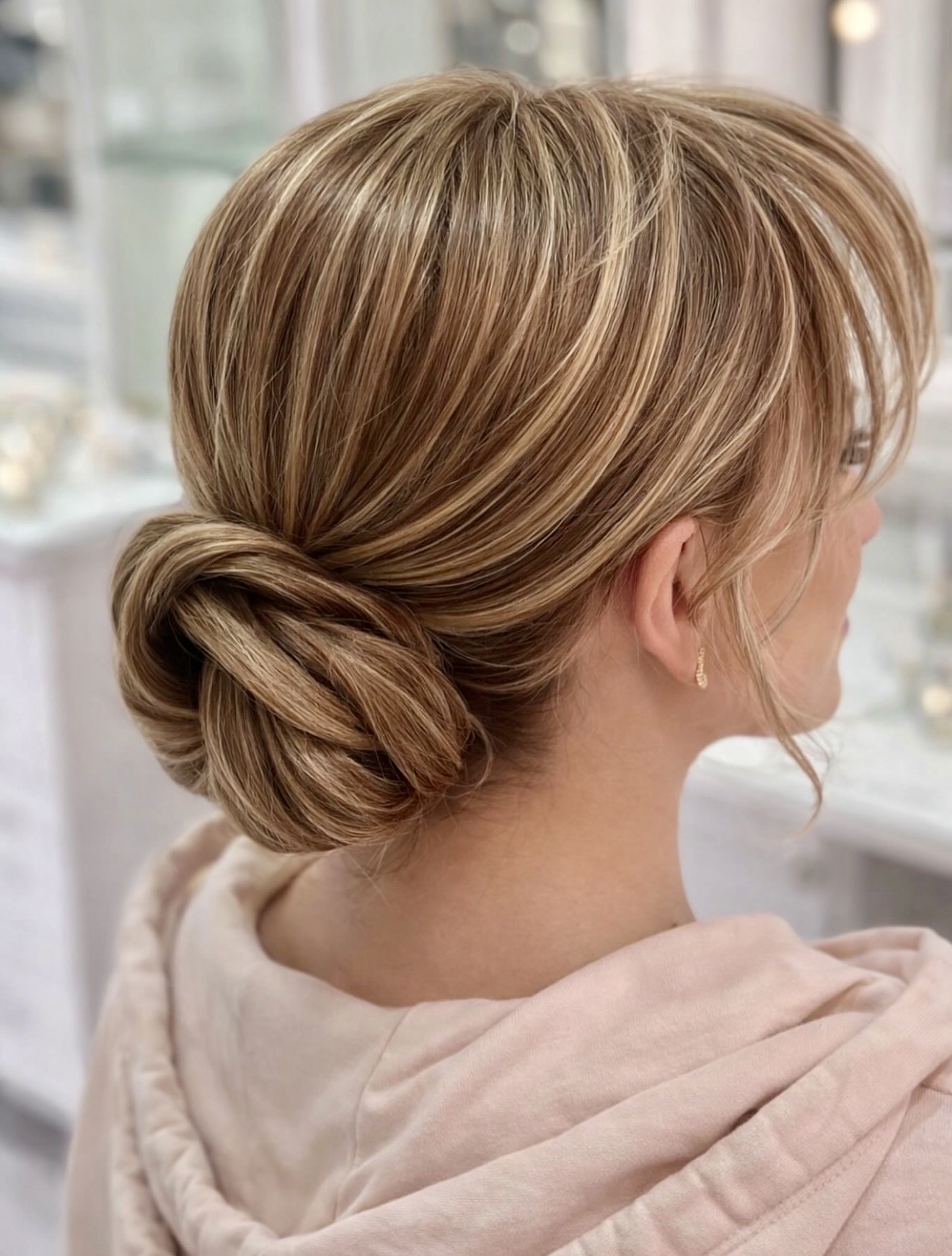 Elegant Twisted Low Bun With Face-Framing Pieces