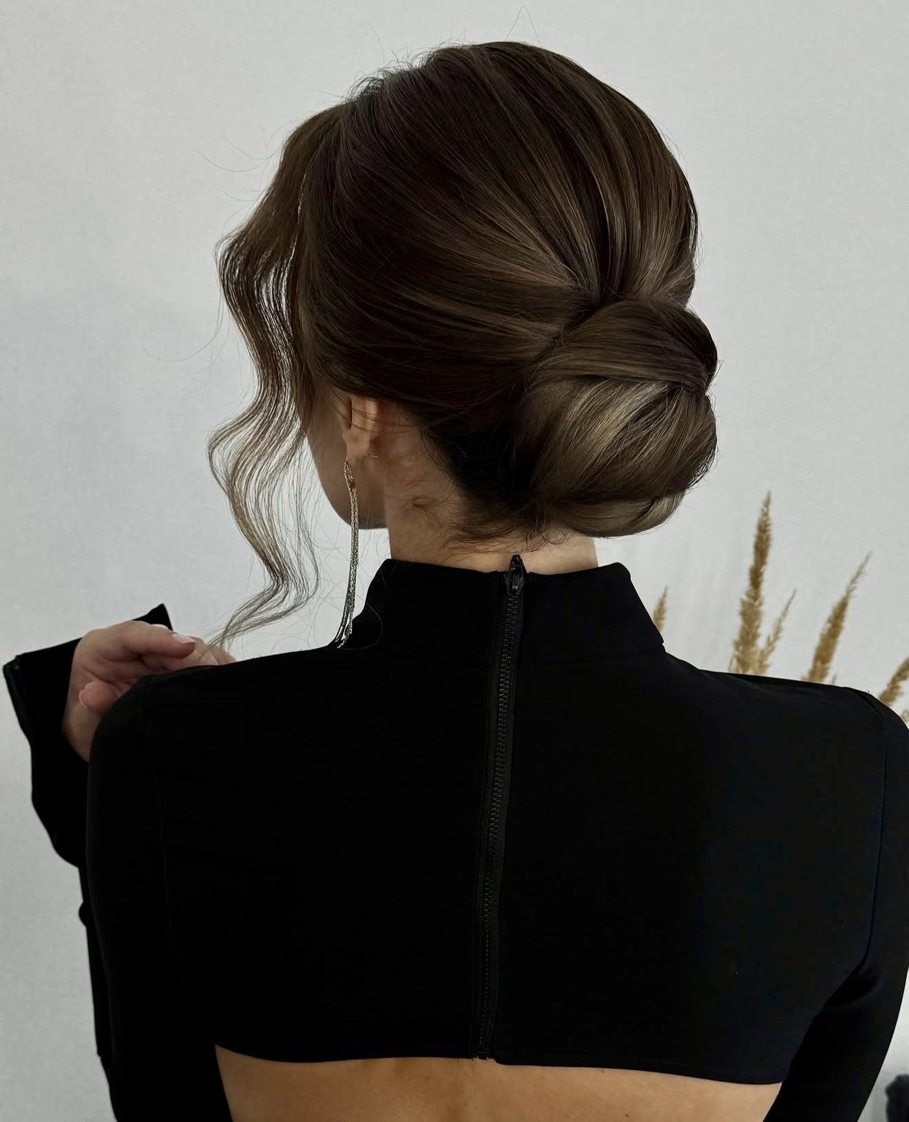 Elegant Twisted Low Bun With Face Framing Pieces