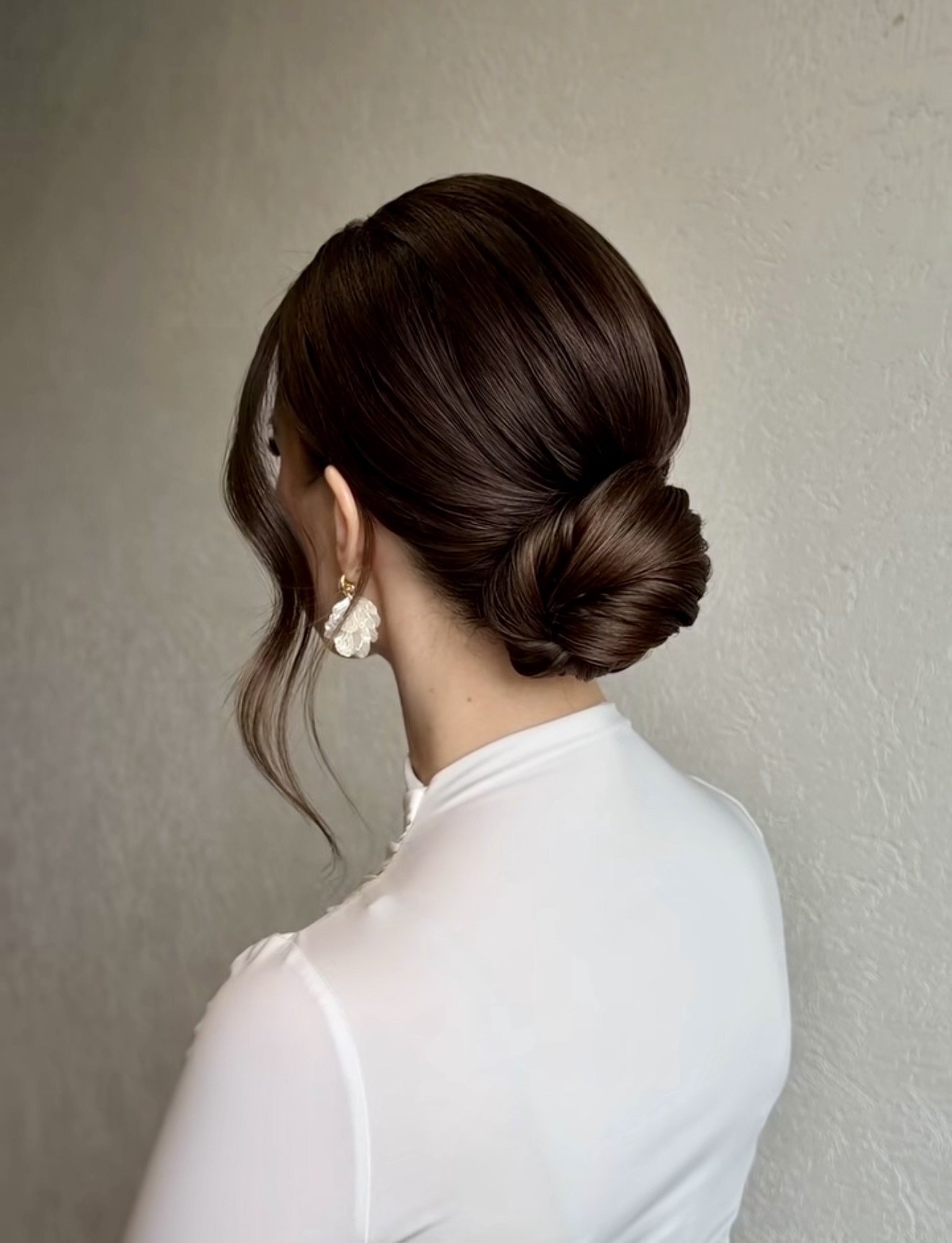 Elegant Twisted Low Bun With Face Framing Strands