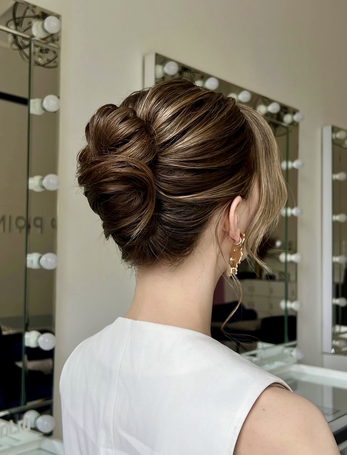 Elegant Twisted Low Bun With Face-Framing Strands