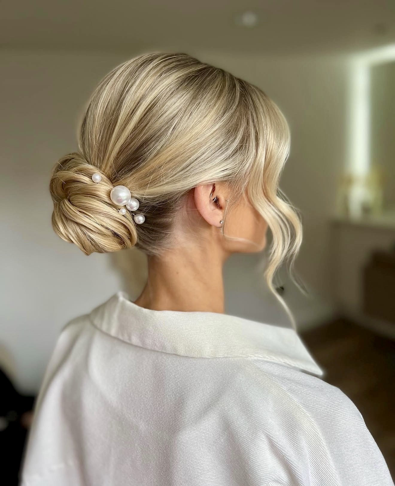 Elegant Twisted Low Bun With Pearl Accents