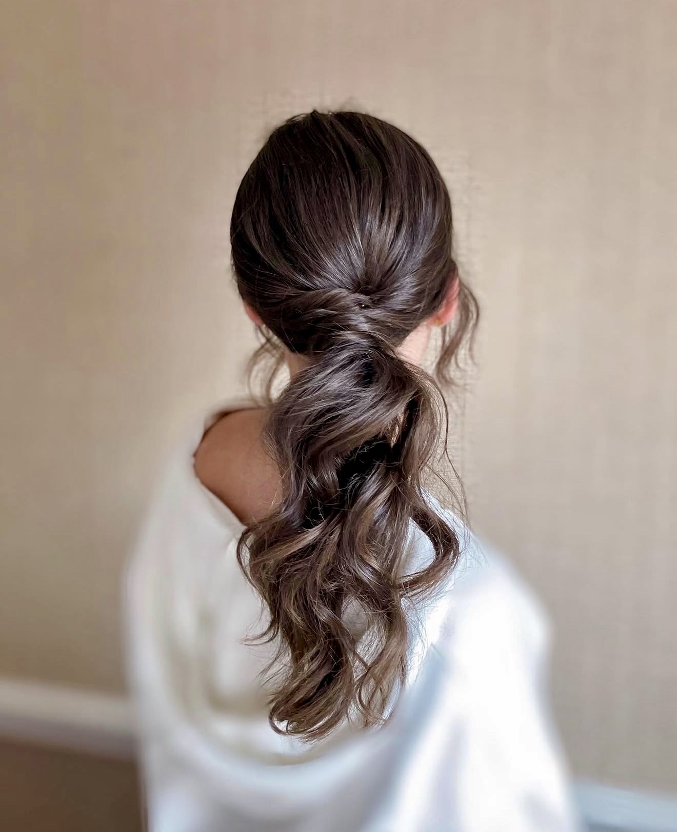Elegant Twisted Low Ponytail With Loose Curls