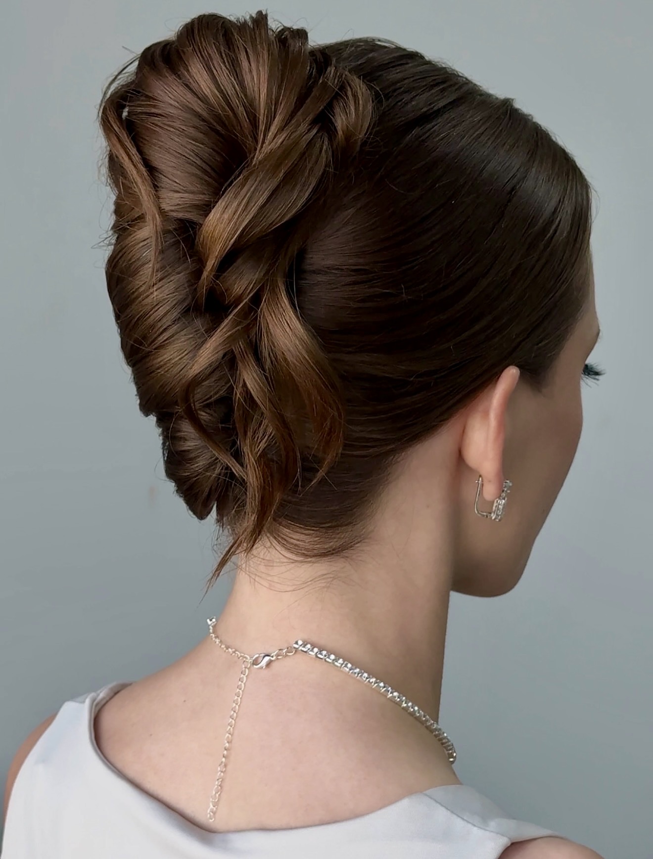 Elegant Twisted Updo Low Bun Hairstyle