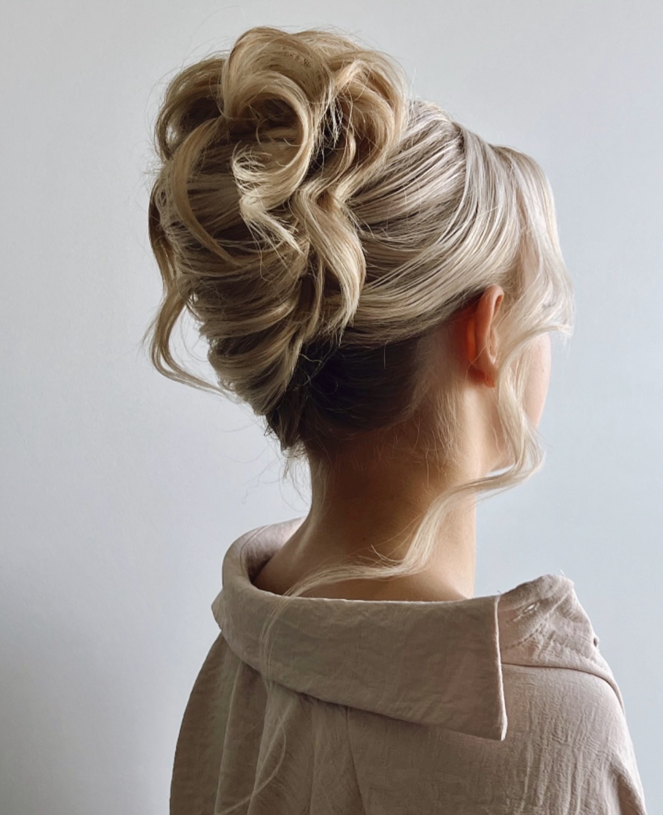 Elegant Twisted Updo With Face-Framing Tendrils