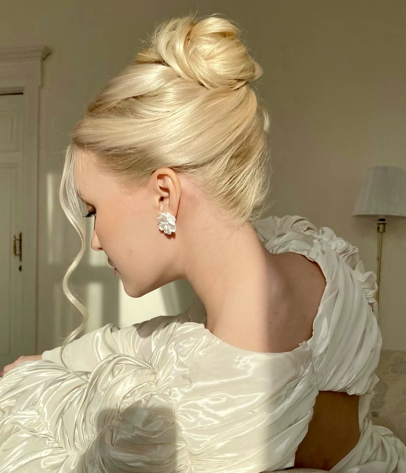 Elegant Voluminous High Bun With Face-Framing Wisps