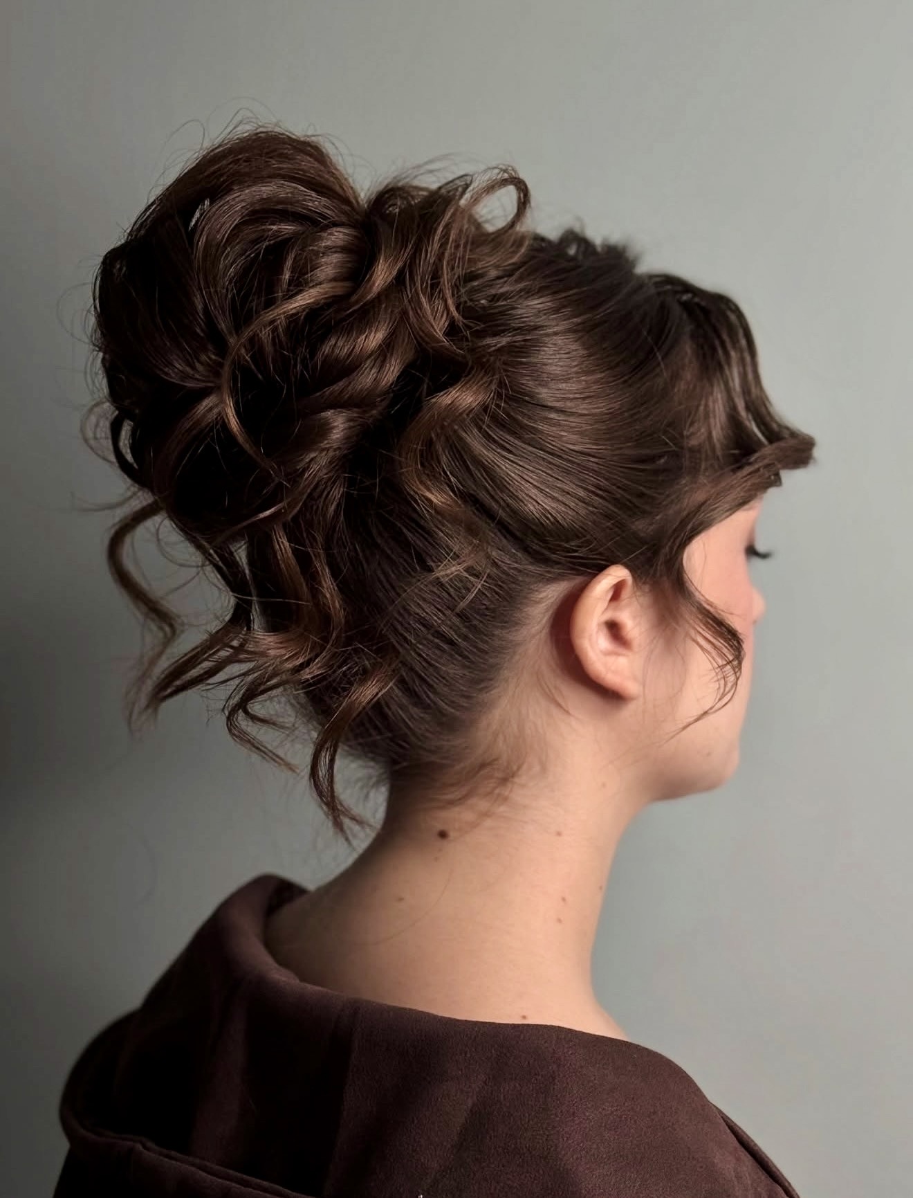 Elegant Wavy Updo With Wispy tendrils