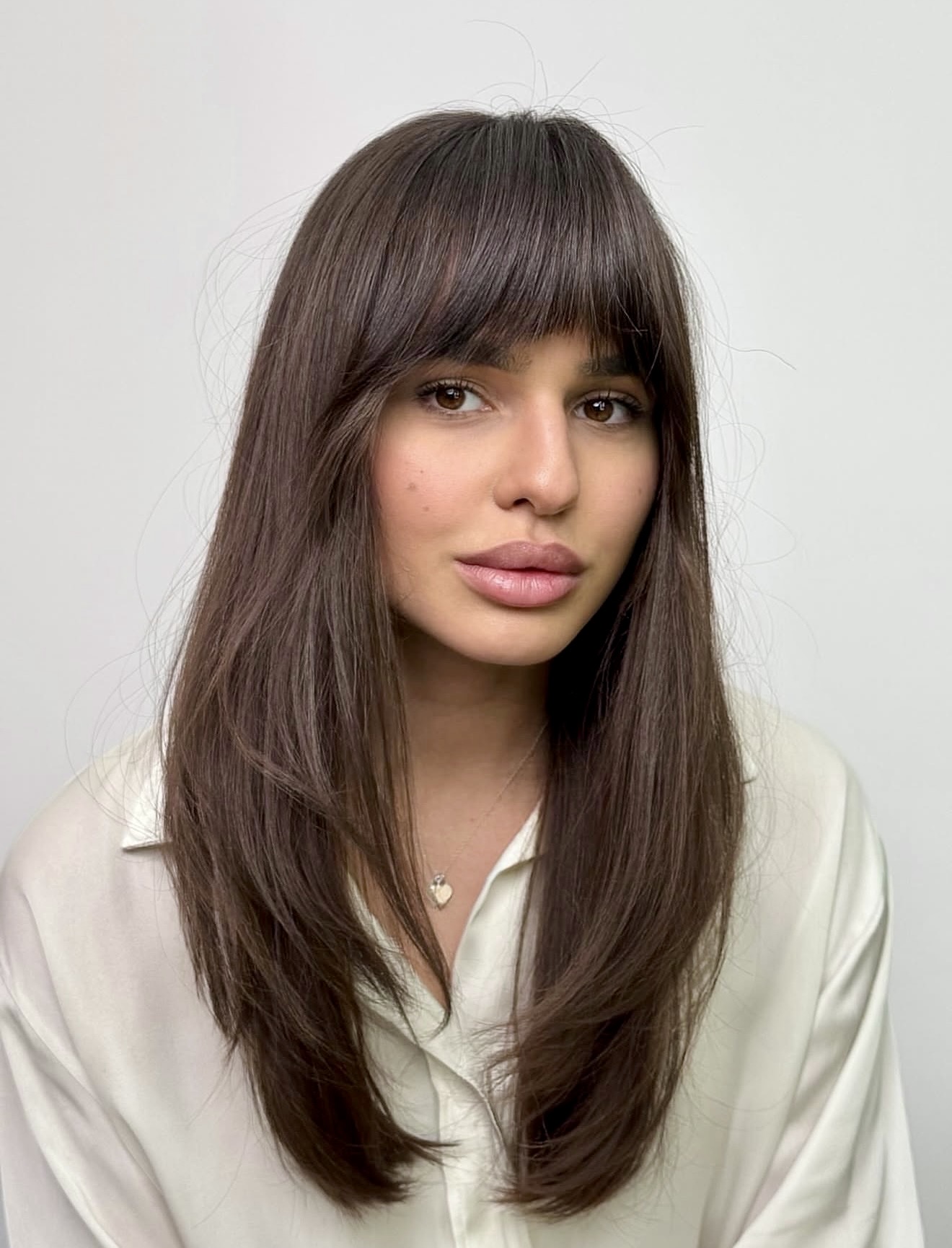 Face-Framing Layers With Wispy Bangs