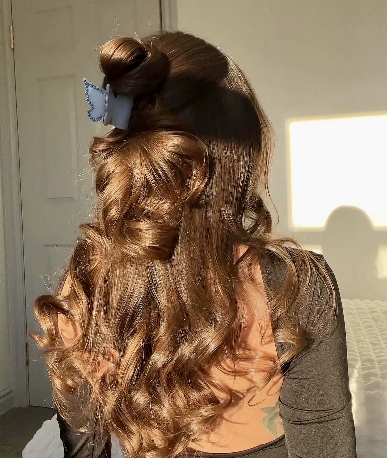 Glamorous Half-Up Two-Bun With Loose Waves