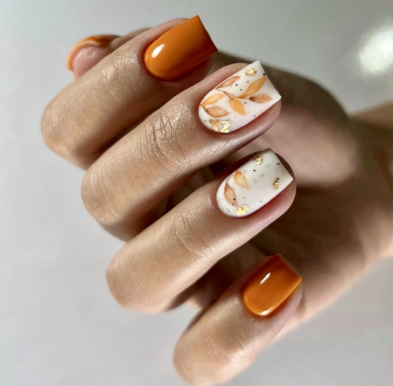 Glossy Orange and Autumn Leaf Accent Nails