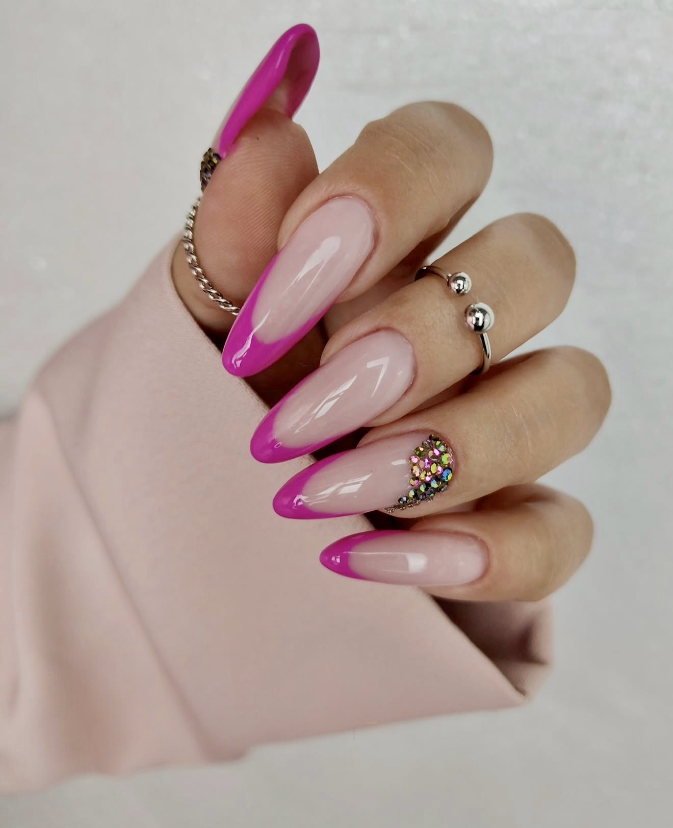 Hot Pink French Tip Almond Nails with Rhinestone Accent