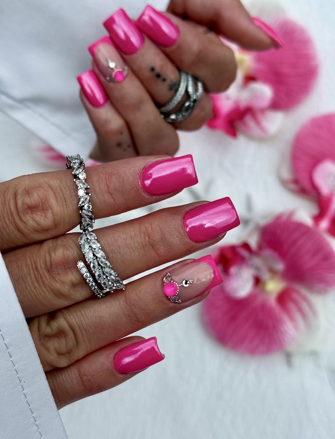 Hot Pink Glossy French Tip Nails with Rhinestone Accent