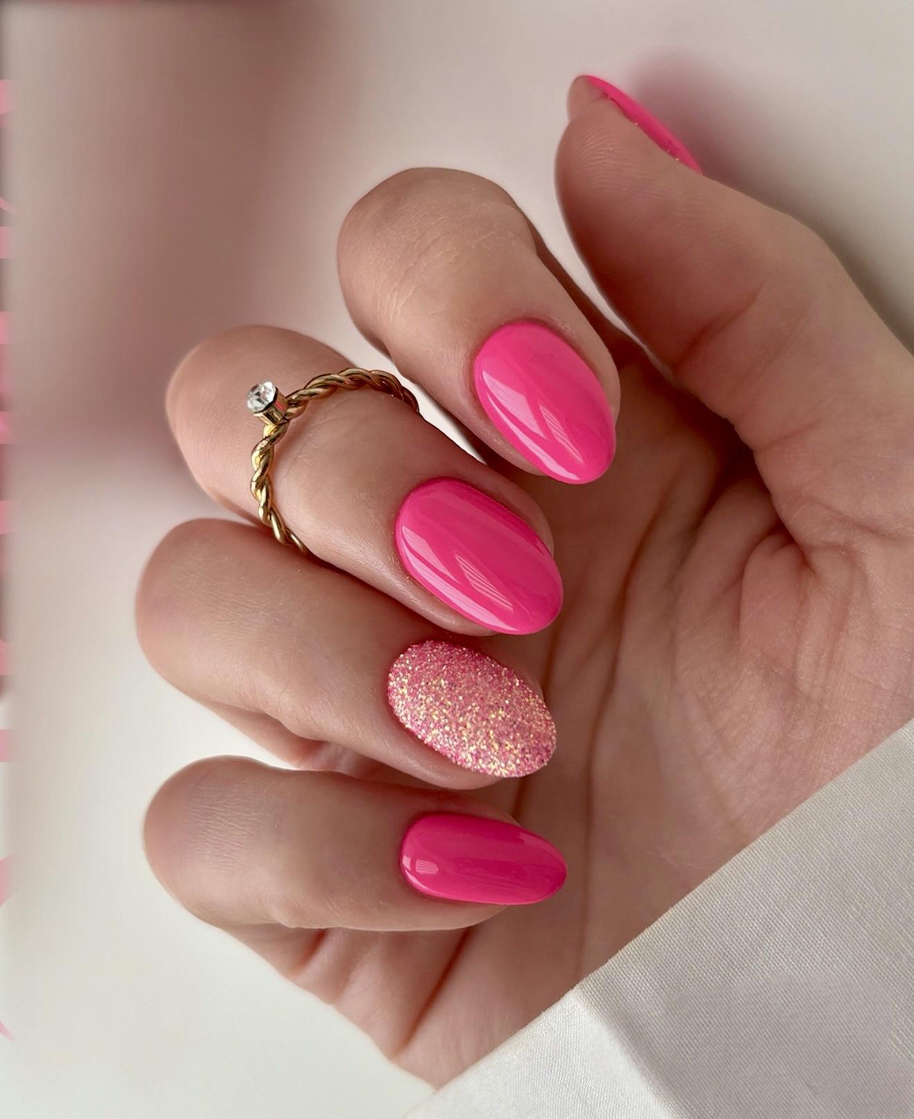 Hot Pink Glossy Oval Nails with Glitter Accent
