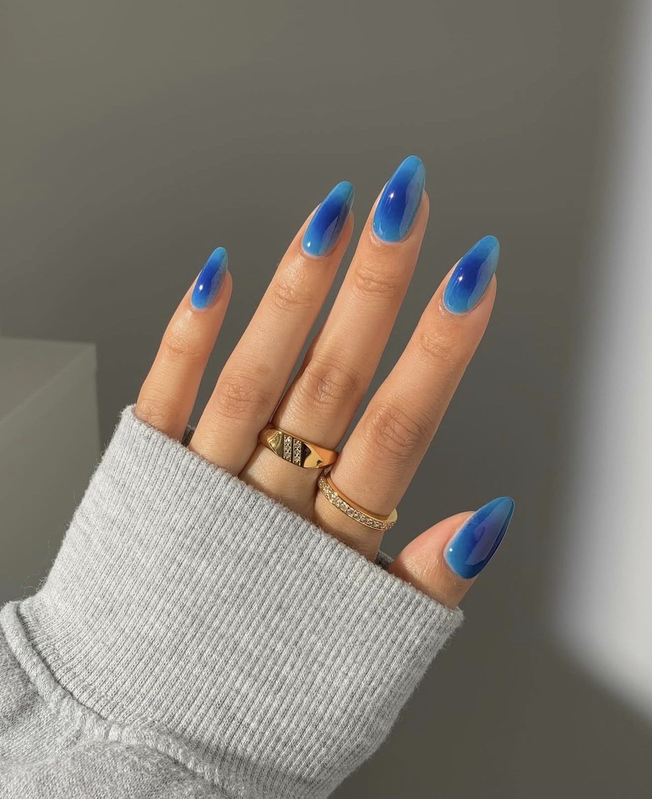Icy Blue Aura Jelly Ombre Almond Nails