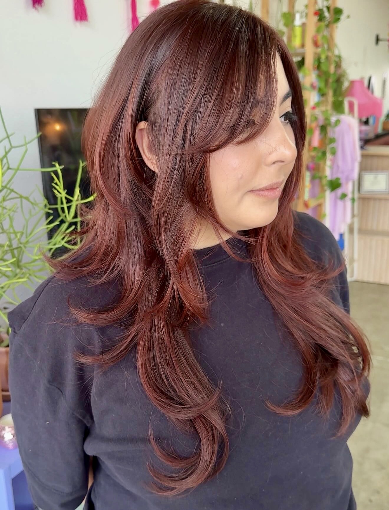 Layered Burgundy Wolf Cut With Face Framing Bangs