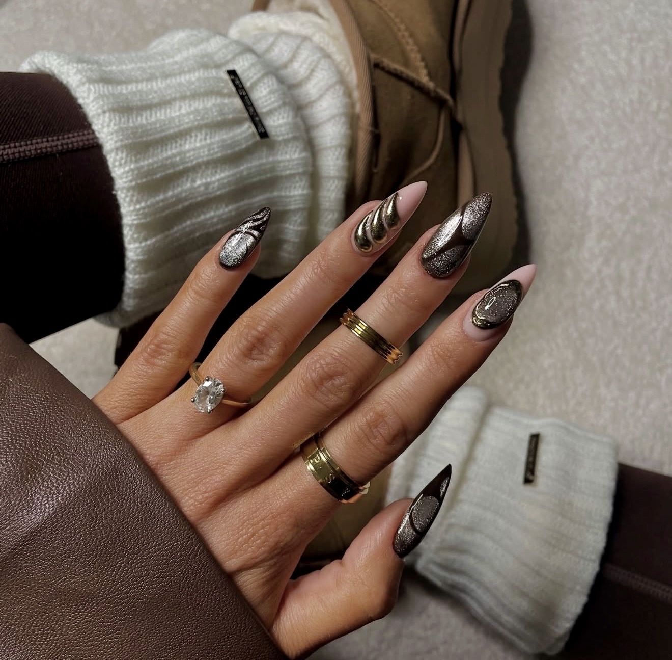Metallic Swirl Almond Nails with Glitter Accents