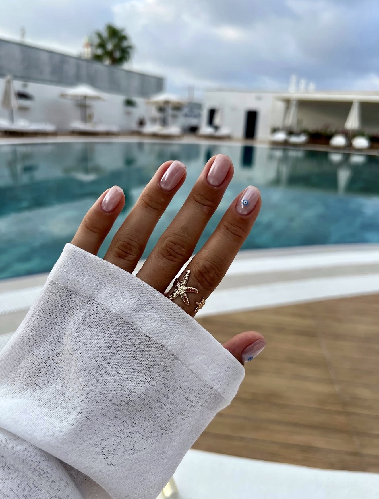 Milky Pink Nails With Evil Eye & Starfish Accents