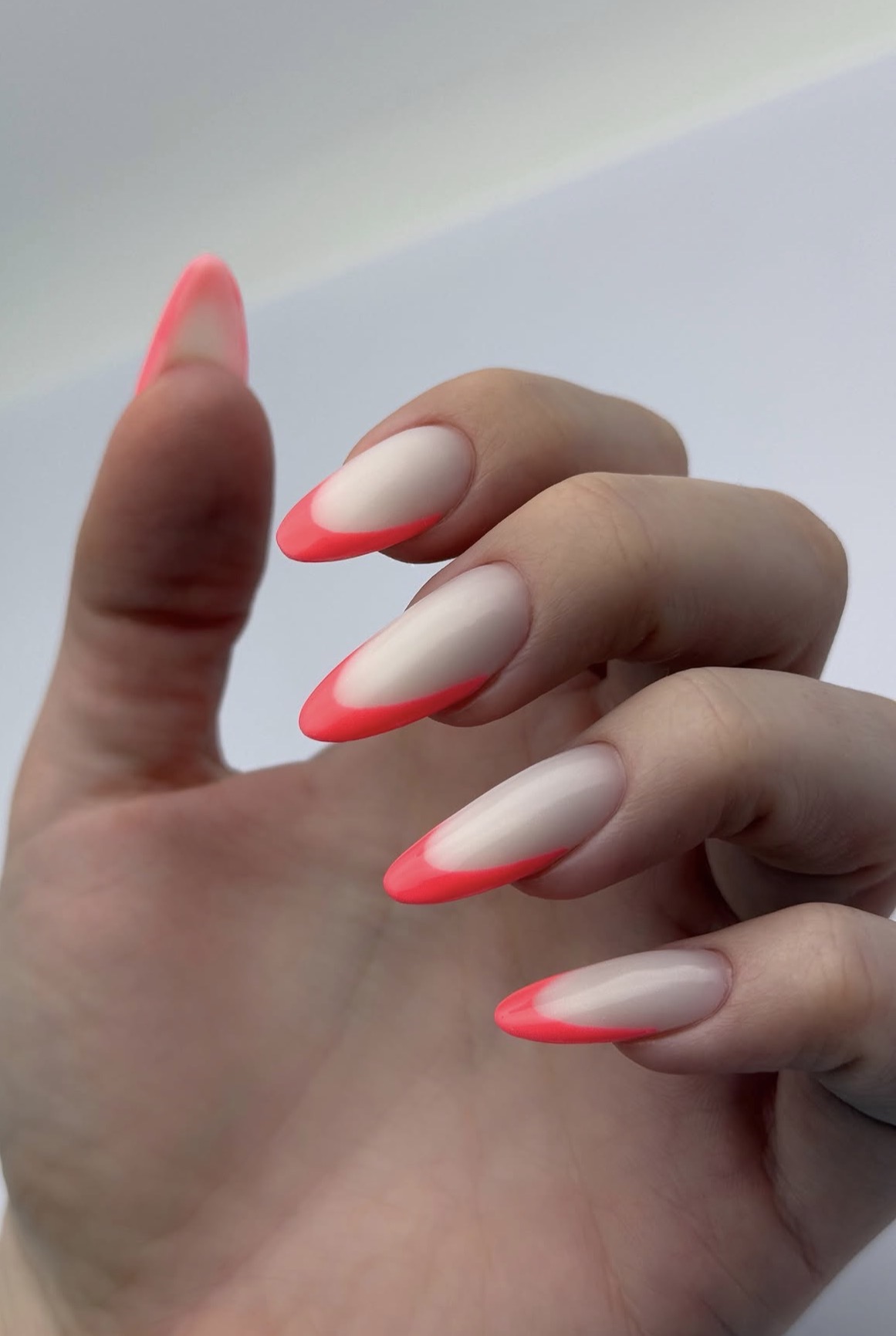 Neon Coral French Tip Almond Nails