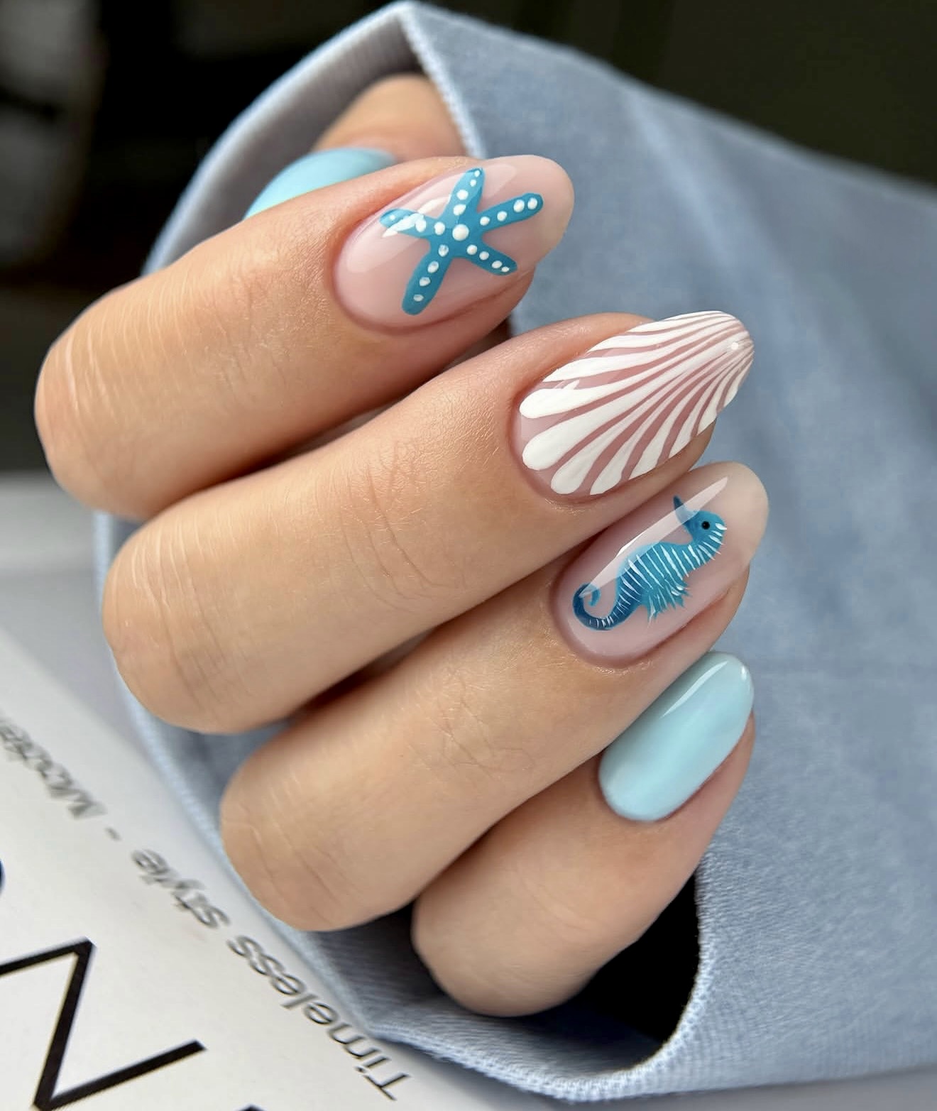 Oceanic Charm Seahorse and Shell Nail Art