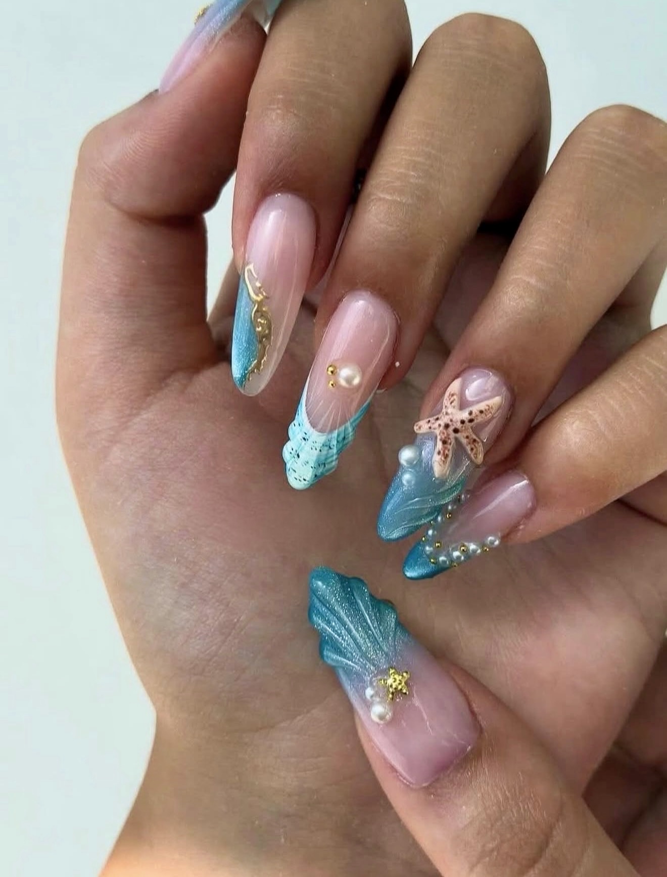 Oceanic Shell French Tip Almond Nails