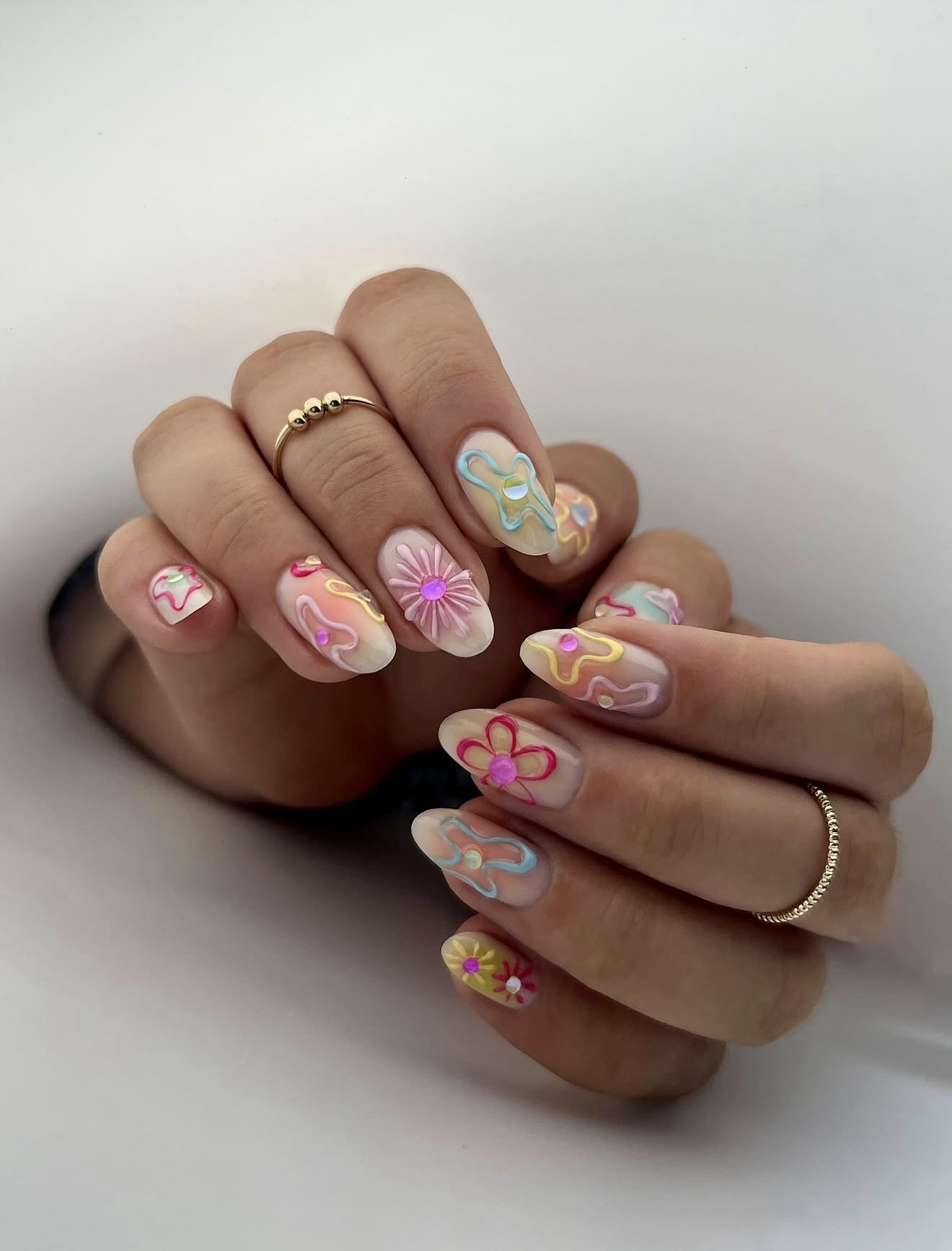 Pastel 3D Swirls And Flowers Almond Nails