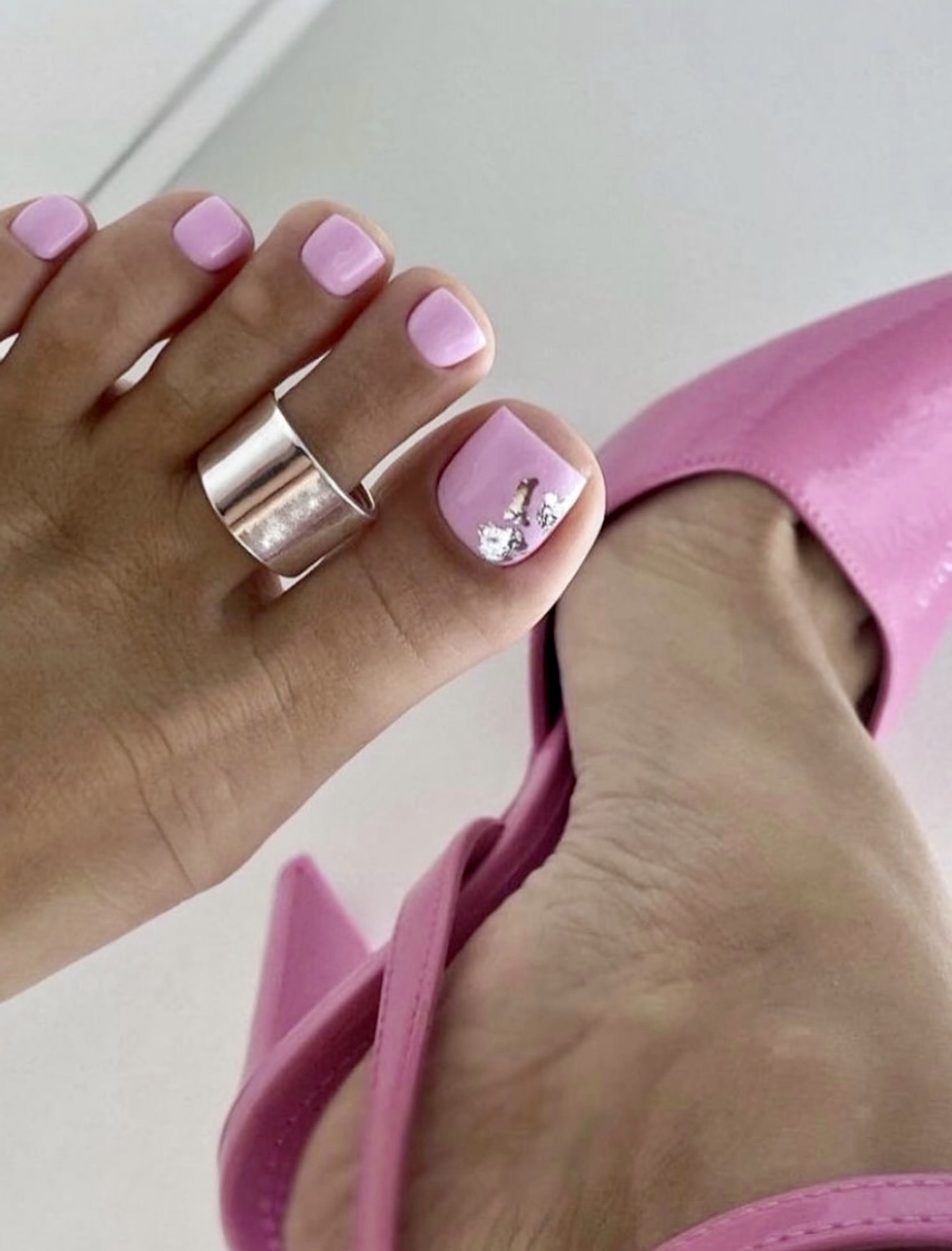 Pastel Pink French Tip Pedicure with Chrome Accents