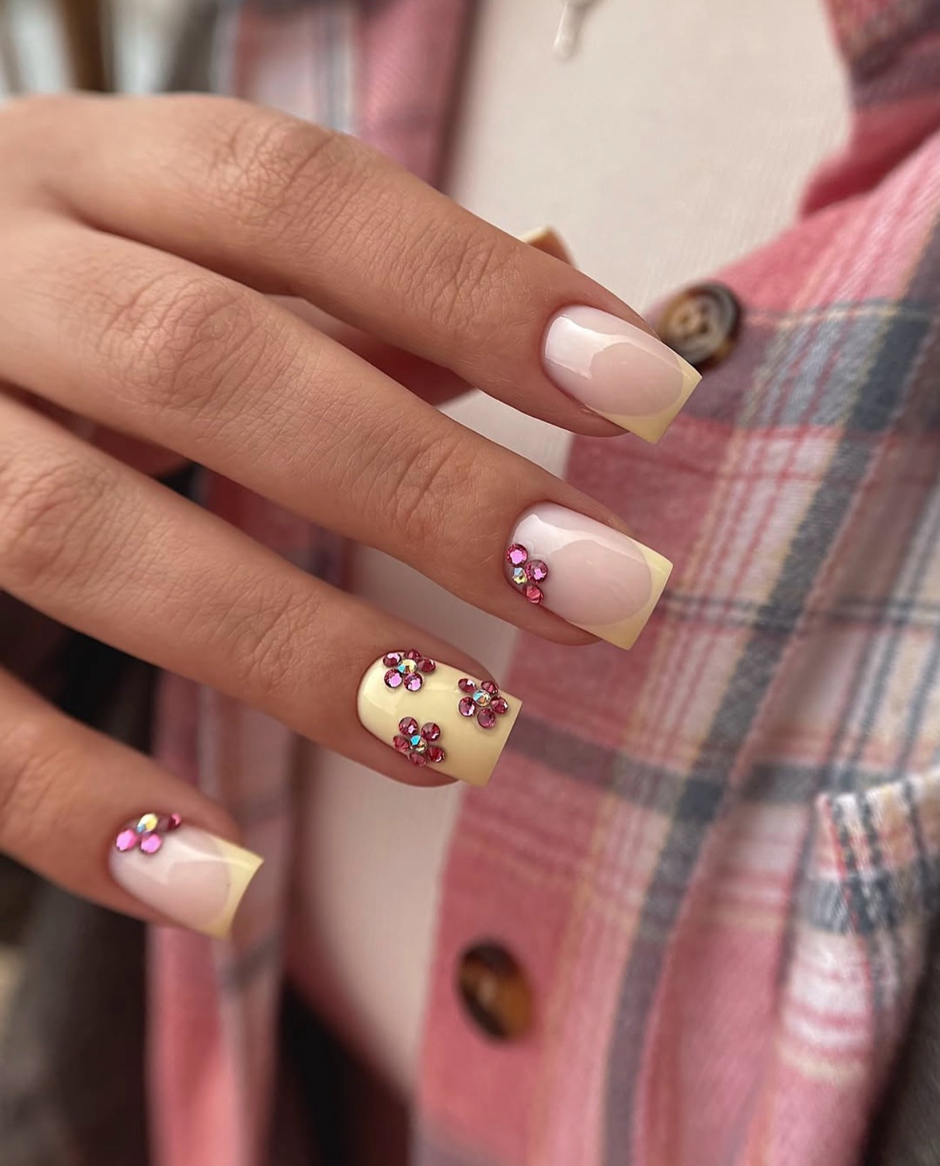 Pastel Yellow French Tip Nails with Rhinestone Flowers