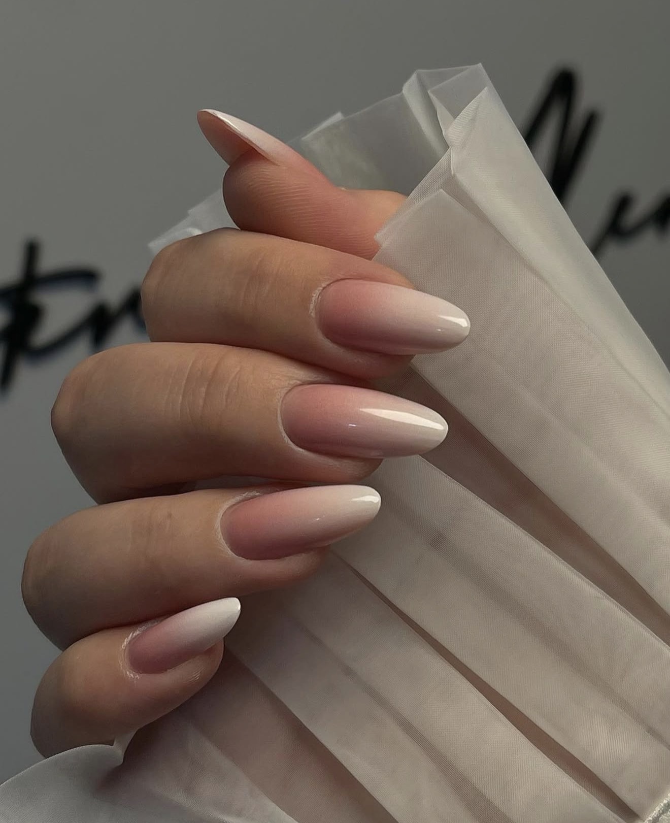Peachy Pink Milky Ombre Almond Nails