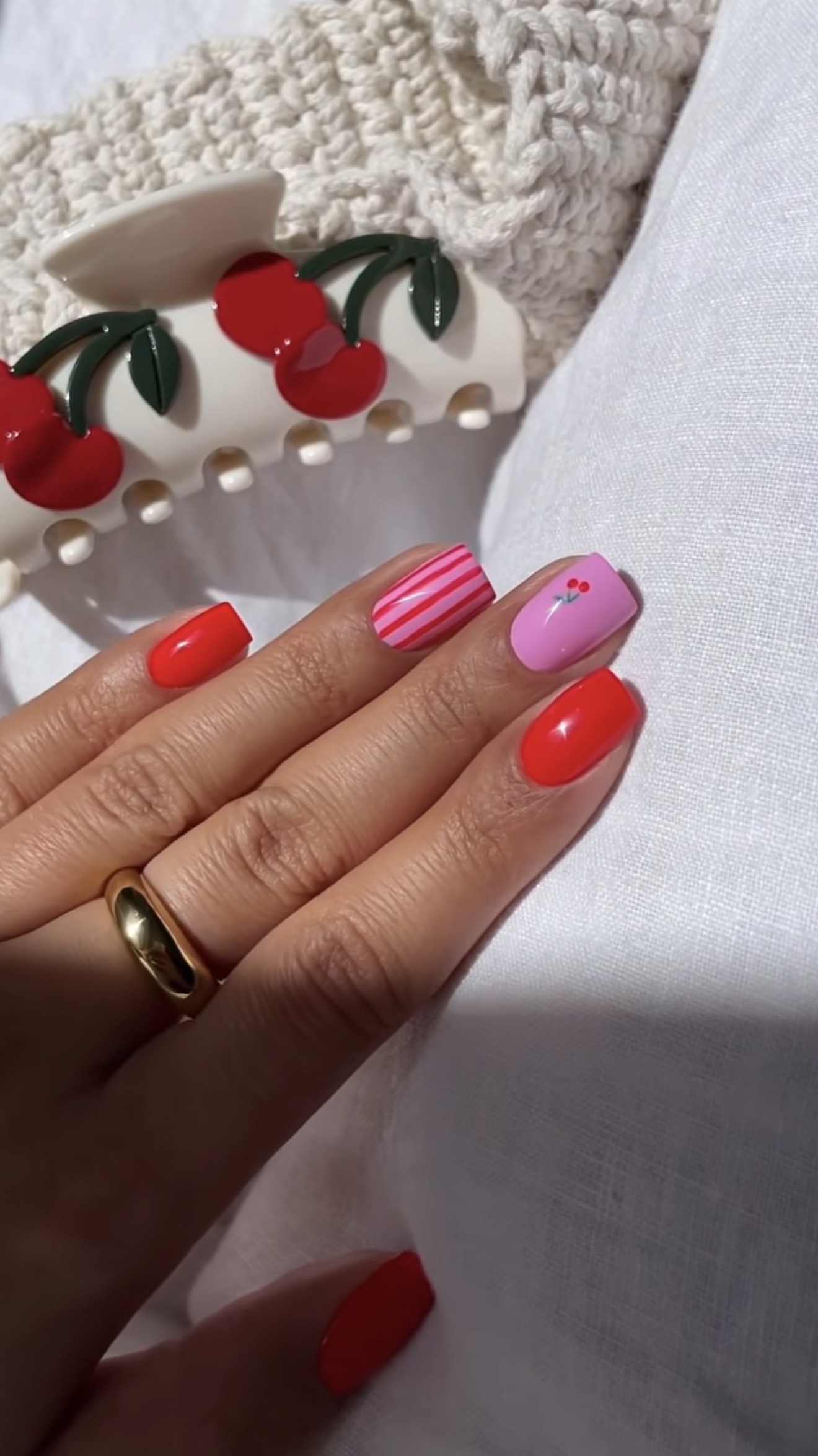 Playful Cherry Red and Pink Candy Cane Nails