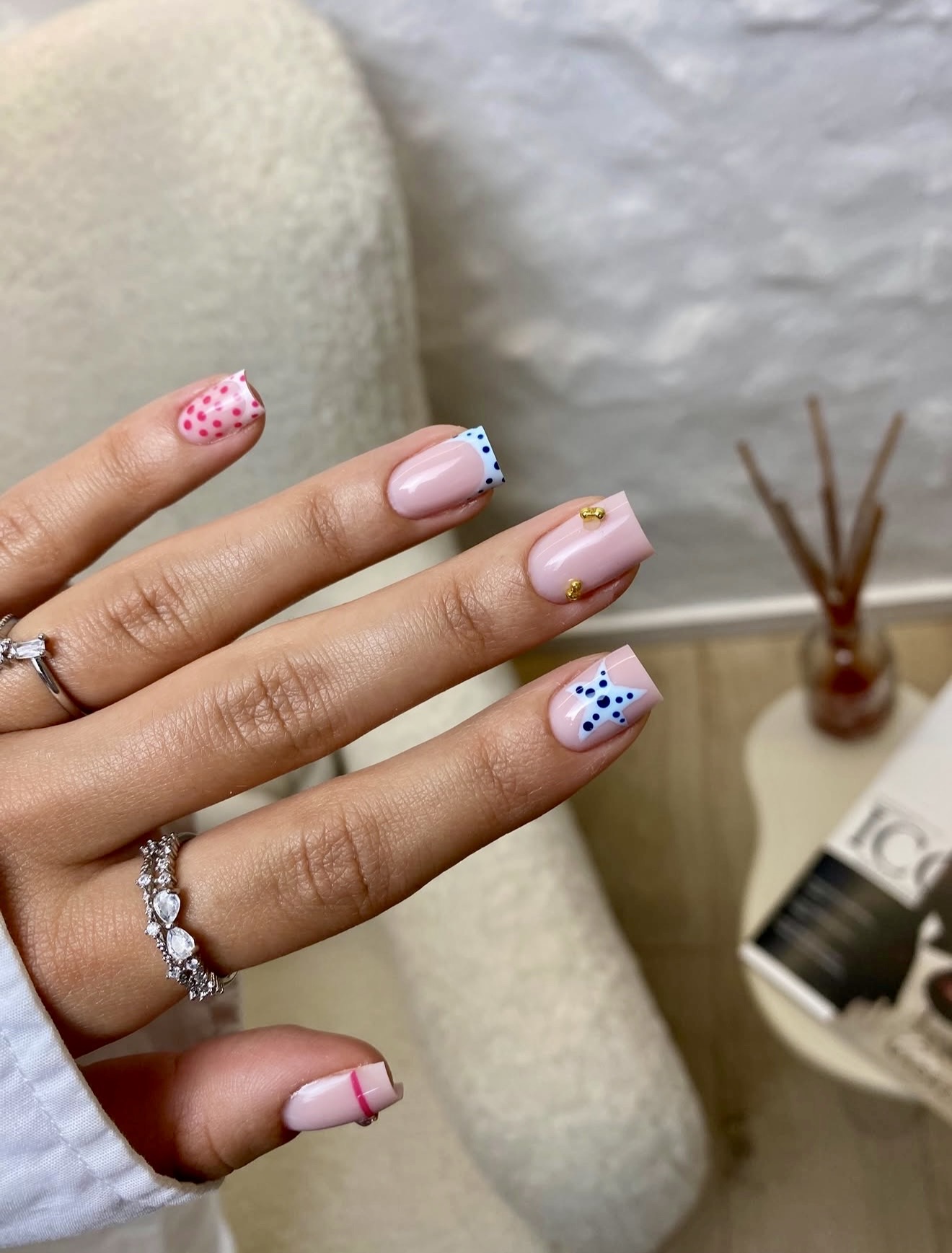Playful Pastel French Tips with Nail Art Accents