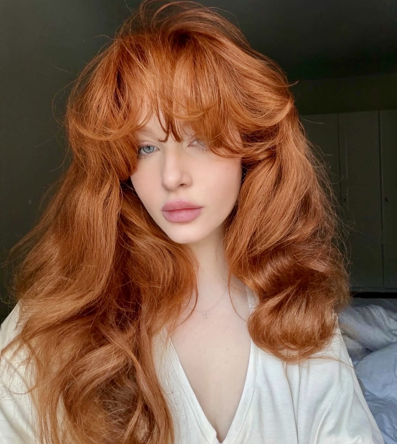 Rich Auburn Waves With Voluminous Curtain Bangs