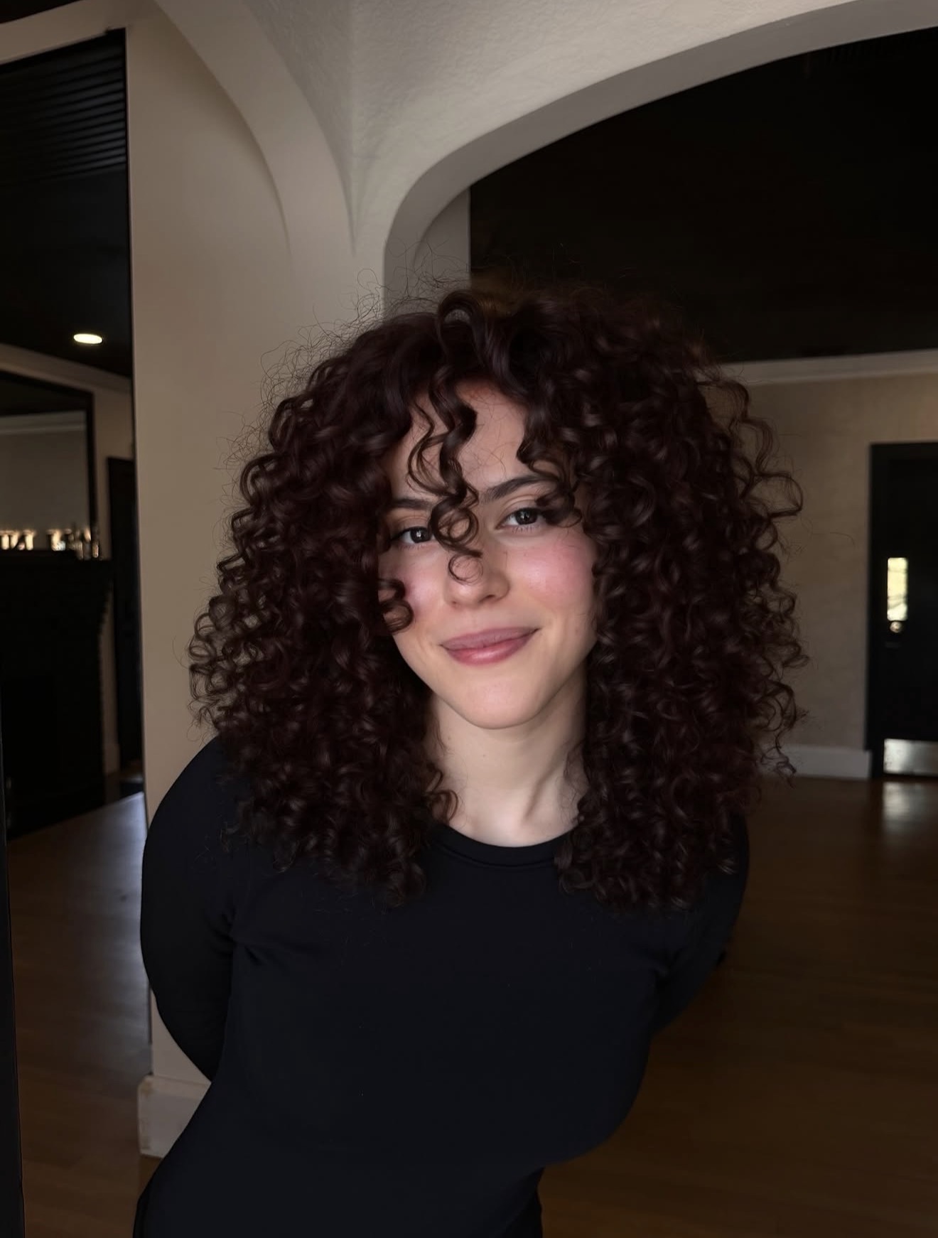 Rich Cherry Cola Curls With Face Framing Bangs