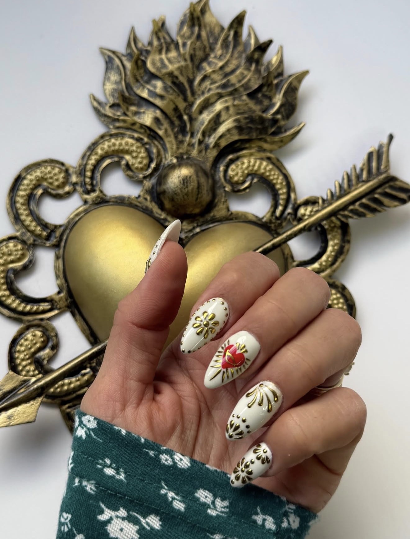 Sacred Heart White Almond Nails with Gold Accents