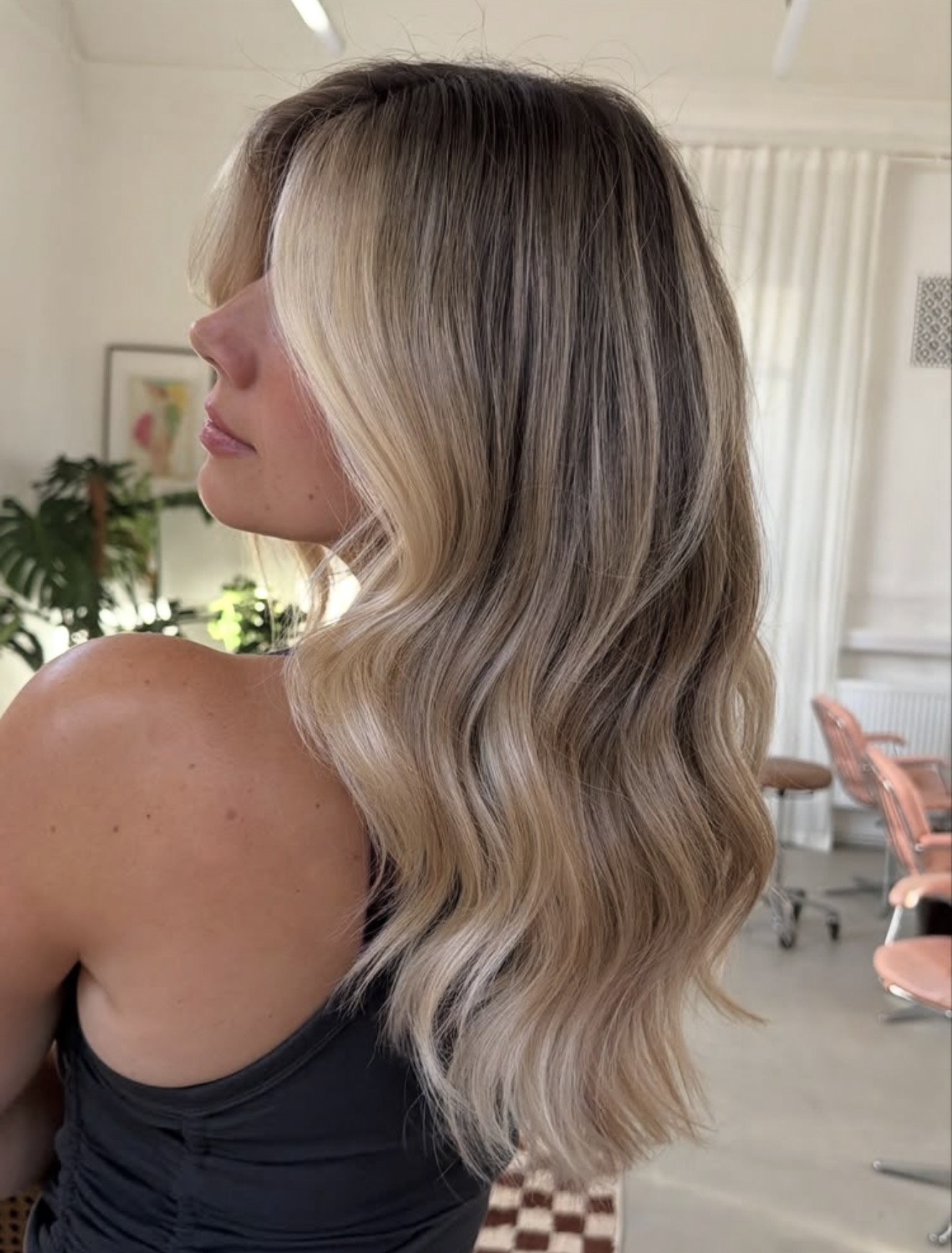 Sandy Blonde Balayage With Soft Face-Framing Waves