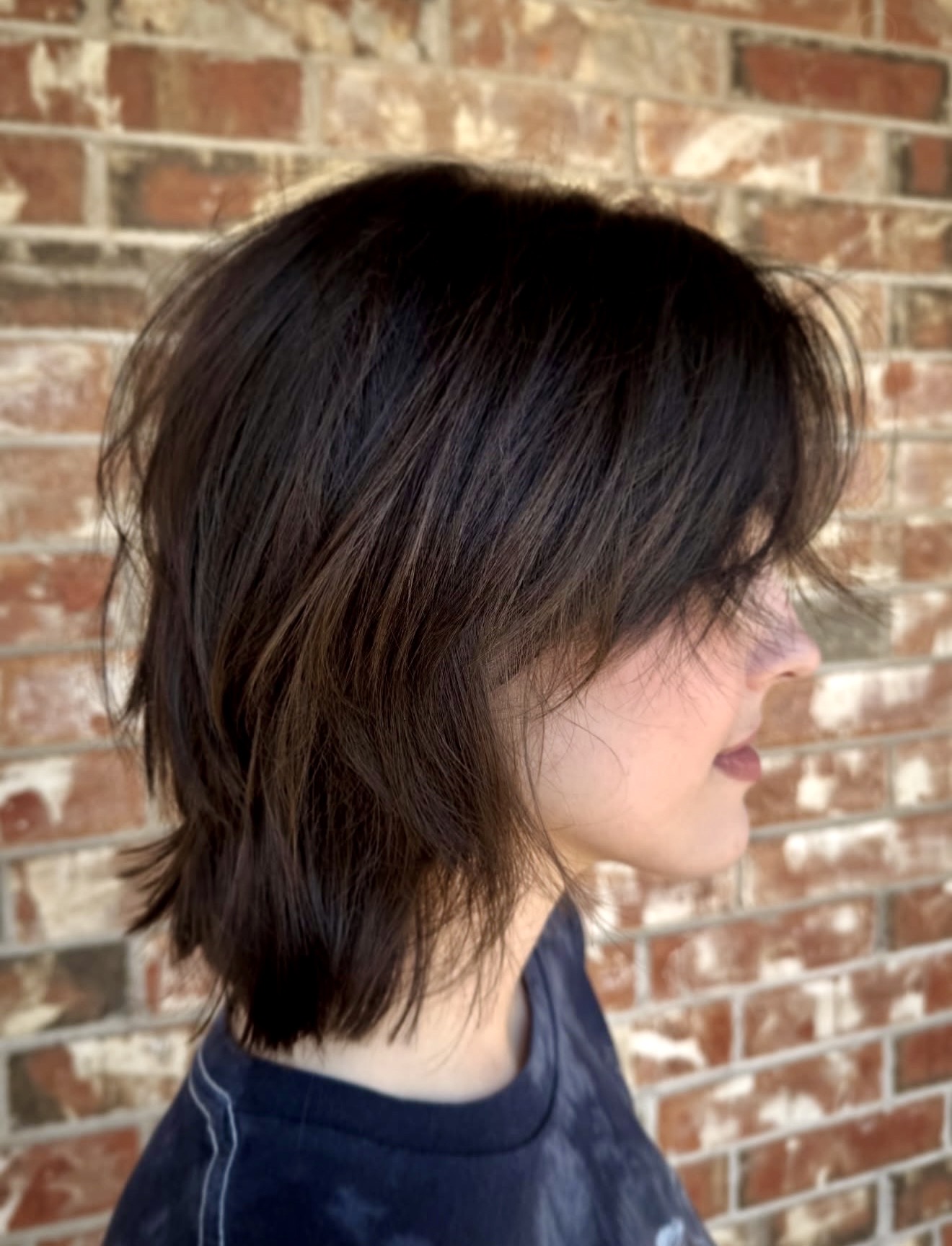 Shaggy Dark Brown Wolf Cut With Wispy Bangs